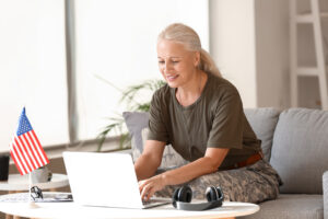 older woman in military uniform on a computer new sign-in