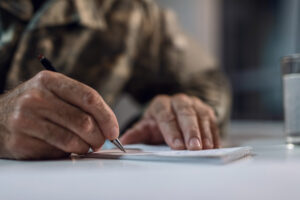 man completing TDIU VA forms